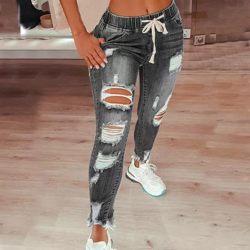 Jeans de mujer de cintura alta con rotos, cintura elástica y cordón, pantalones cómodos y modernos para un look casual y a la moda.