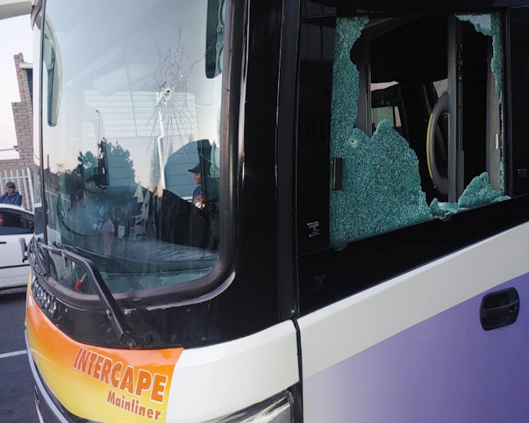 A long-distance bus that was damaged by gunfire.