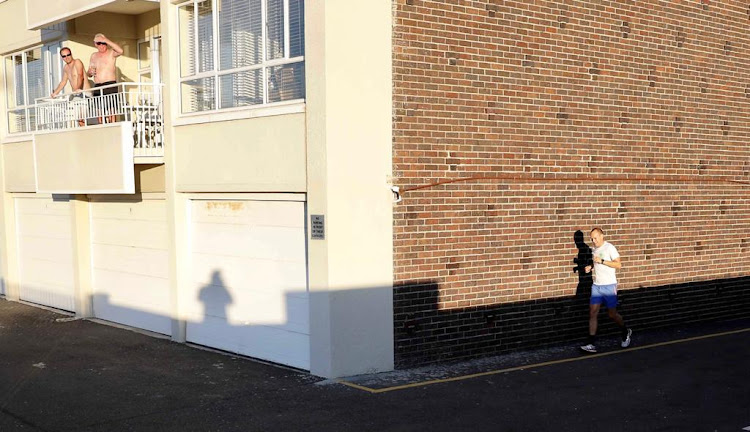 A man makes the most of the parking lot now that the promenade is out of bounds.