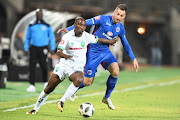 Bradley Grobler of SuperSport United and Siyabonga Nomvethe of AmaZulu FC tussle for the ball during the Absa Premiership match at Lucas Moripe Stadium on August 08, 2018 in Pretoria, South Africa.