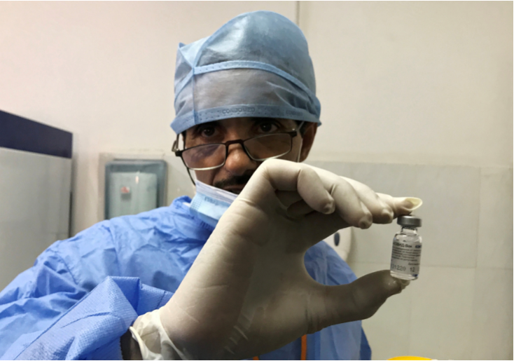 A healthcare worker holds a vial of the Sputnik V vaccine against the coronavirus disease, as Algeria launches a coronavirus vaccination campaign, in Blida, Algeria on January 30, 2021. FILE PHOTO