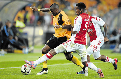 NO WAY THROUGH: Mosa Lebusa of Ajax Cape Town tries to dispossess George Maluleka of Kaizer Chiefs during the Absa Premiership match between Amakhosi and the Urban Warriors at FNB Stadium, outside Soweto, last night