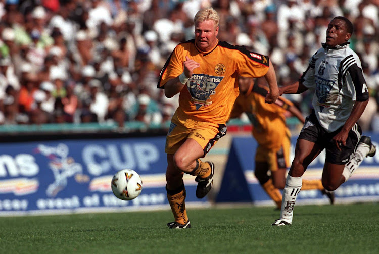 A file photo of Marc Batchelor in the colors of Kaizer Chiefs getting past Orlando Pirates defender Gerald Raphahlela during the 1998 Rothmans Cup semi-final second leg match at FNB Stadium.