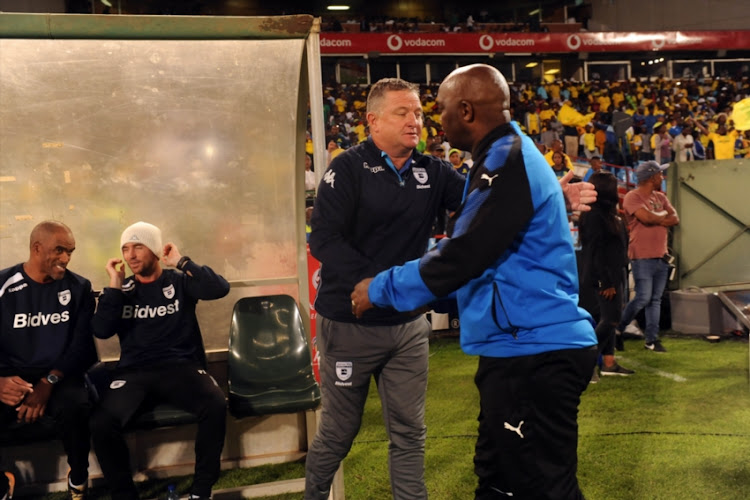 Pitso Mosimane of Mamelodi Sundowns and Gavin Hunt of Bidvest Wits team remember Mama Winnie Mandela during the Absa Premiership match between Mamelodi Sundowns and Bidvest Wits at Loftus Versfeld Stadium on April 14, 2018 in Pretoria, South Africa.