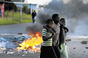 BROTHERS IN ARMS: The aftermath of a service-delivery protest in Ekangala, Mpumalanga, during which a clinic and a library were burned down. File photo