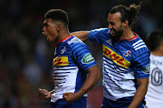 Damian Willemse of the Stormers is congratulated by teammate Dillyn Leyds after scoring a try during the Super Rugby match against Sunwolves at DHL Newlands on July 08, 2017 in Cape Town, South Africa.