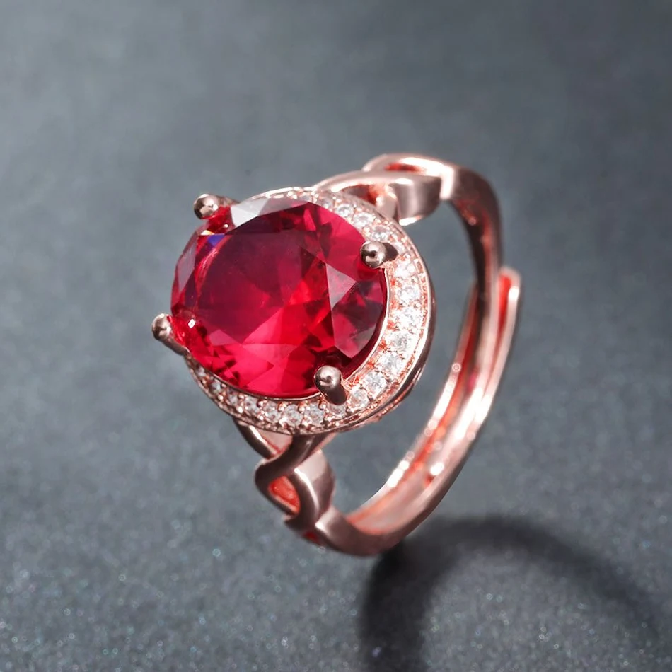 Bague ovale haut de gamme avec pierre précieuse tourmaline rouge simulée, tempérament élégant, idéale pour un style sophistiqué et attrayant.