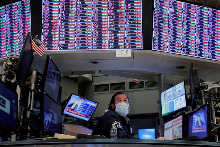 A trader works inside a booth at the New York Stock Exchange. Picture: BRENDAN MCDERMID/REUTERS