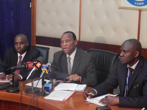 polio-free: Kemri head of disease surveillance and response Dr Daniel Langat, acting director Dr Gerald Mkoji and WHO coordinator of polio eradication for the Horn of Africa Dr Sam Okiror at Kemri offices yesterday.