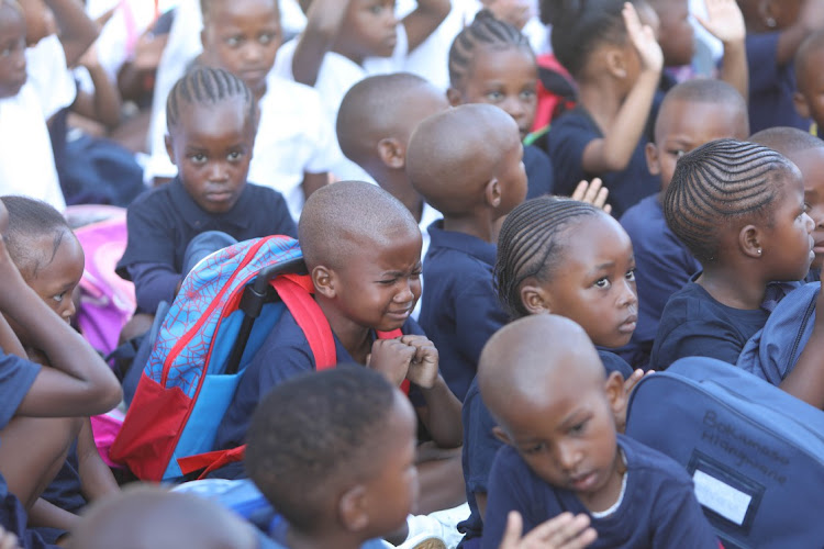 A grade R pupil becomes emotional during assembly at Cosmo City Primary on January 11 2023, the start of the academic year for primary and high schools in the five inland provinces.