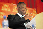 Mokotedi Mpshe, as National Prosecuting Authority acting head in 2009, announces his decision to drop corruption charges against Jacob Zuma