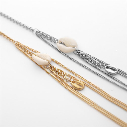 Title 10, Dijbeenketting met dubbele schelpen hanger. Sex...