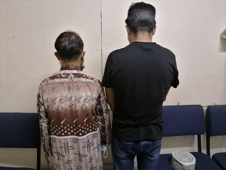 Two suspects allegedly tried to bribe a community activist to persuade the parents of a rape victim to drop the charges.