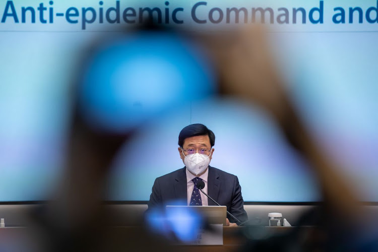 Hong Kong CEO John Lee during a press conference in Hong Kong on December 28 announcing the end of some of its last major Covid-19 rules, scrapping limits on public gatherings and no longer requiring proof of vaccination for entry to some venues, in a sweeping overhaul of policies aimed at reviving its reputation as a global financial centre. Photographer: BLOOMBERG/PAUL YEUNG