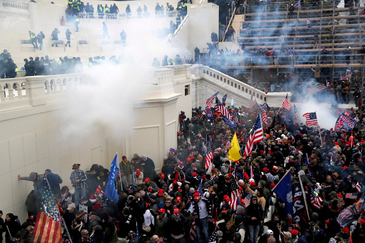 Police fire teargas into a crowd of pro-Trump protesters at the US Capitol Building in Washington, the US, January 6 2021. Picture: REUTERS/SHANNON STAPLETON