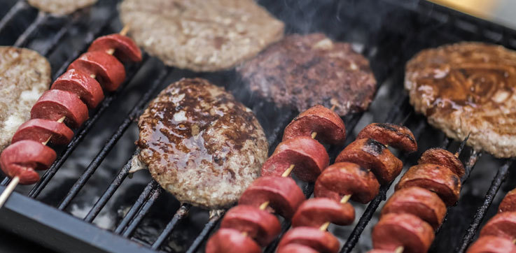 Burgers and sausages on a barbecue