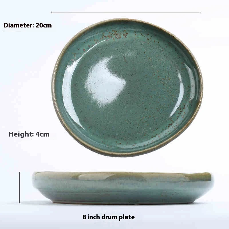Assiette de vaisselle rétro créative en céramique simple, de forme irrégulière, idéale pour une présentation de table élégante et originale.
