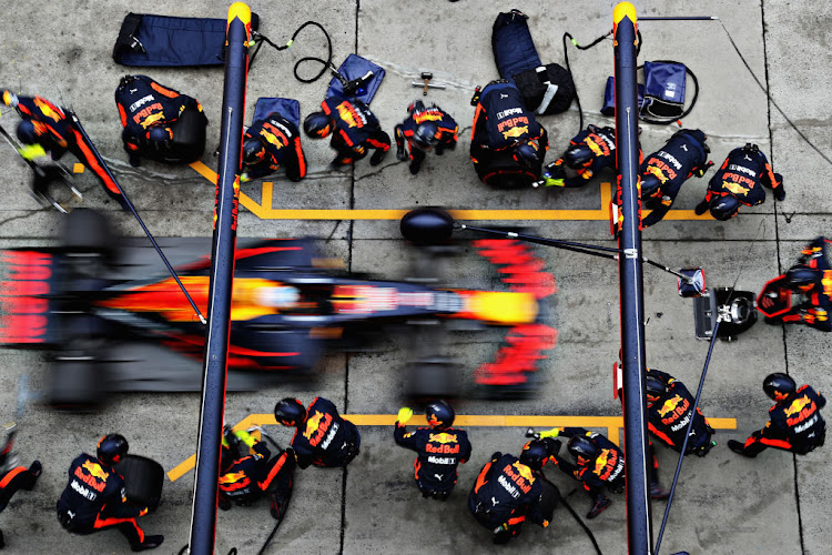 The need for speed: Red Bull's Daniel Ricciardo makes a pit stop at the Formula One Grand Prix in China. PICTURE: Getty Images/Mark Thompson