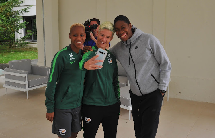 Caster Semenya poses for a photograph with Banyana Banyana forward Busisiwe Ndimeni and Janine van Wyk during the 2019 Fifa Women's World Cup in France in June.