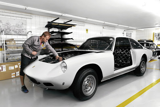 Working on a Ferrari 330 GTC.