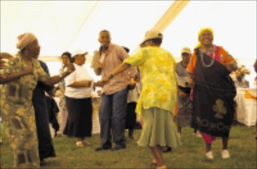 TIME TO BOOGIE: Elderly people dance to music during the celebration of Grandparents Day at the Apostolic Faith Mission Church in Atteridgeville, Pretoria, yesterday. Pic. Peggy Nkomo. 05/10/08. © Sowetan.