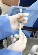 A healthcare worker prepares the Sputnik V vaccine against the coronavirus disease (Covid-19), during a national vaccination campaign, in Algiers, Algeria January 31, 2021. 