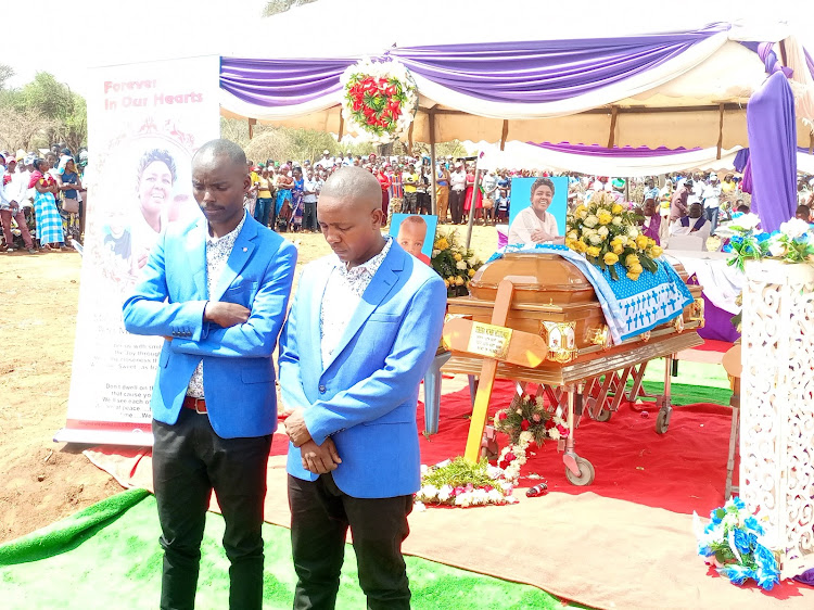 Widower Samuel Mulyungi and his cousin Tony Mathembe during the funeral service on Saturday.