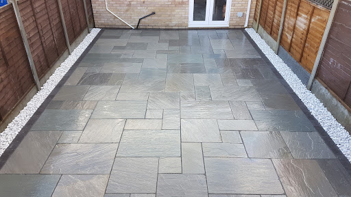 Kandla grey sandstone with charcoal boarder and white stone edging 