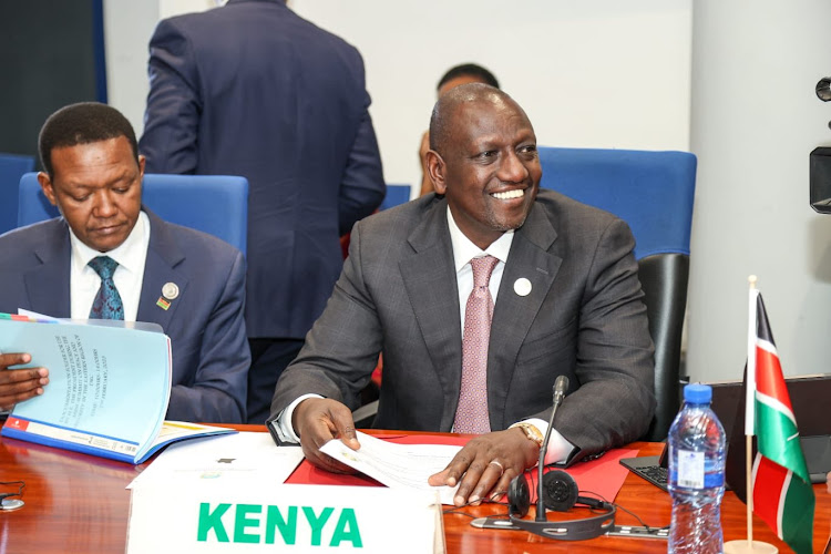 Foreign Affairs Cabinet Secretary Alfred Mutua and President William Ruto attending the peace and security for Eastern region Democratic Republic of Congo mini-summit in Addis Ababa Ethiopia on February 17.