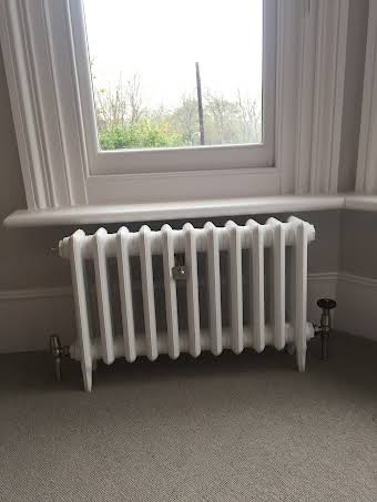 Cast iron radiator installation. album cover