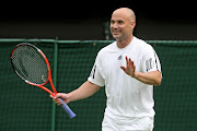 Andre Agassi reacts during the Mens Singles match against Tim Henman during the 