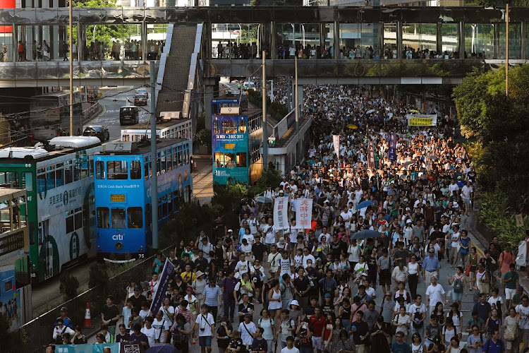 Demonstrators march in Hong Kong. Picture: REUTERS