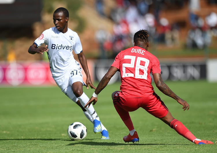 Terrence Dzvukamanja of Wits in action with Mthokozisi Dube of Orlando Pirates during the Absa Premiership match between Bidvest Wits and Orlando Pirates at Bidvest Stadium on April 06, 2019 in Johannesburg, South Africa.