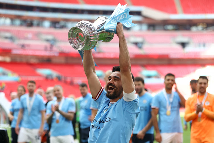 Manchester City's Ilkay Gundogan celebrates with the trophy after winning the FA Cup at Wembley Stadium in London, Britain, June 3 2023. Picture: PAUL CHILDS/ACTION IMAGES/REUTERS