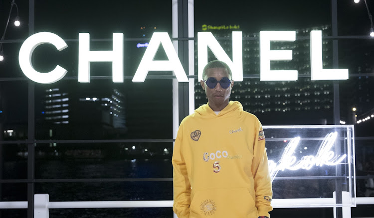 Pharrell Williams in Chanel and Adidas During Paris Fashion Week