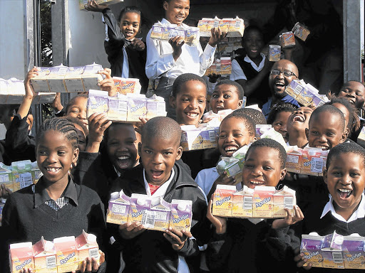 Children with hampers from FoodBank SA, the organisation that will benefit from the Hampers for Hunger campaign