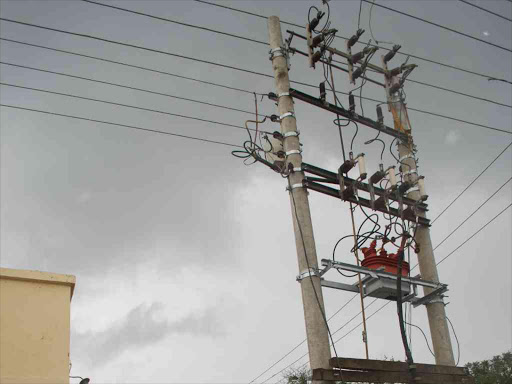 A man looking at a power transformer in Nakuru town where two men were electrocuted during Kplc power lane maintenance./FILE