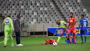 Cape Town City head coach Benni McCarthy watches on as a Highlands Park player lies down injured during a Absa Premiership match at Cape Town Stadium on April 23 2019.   