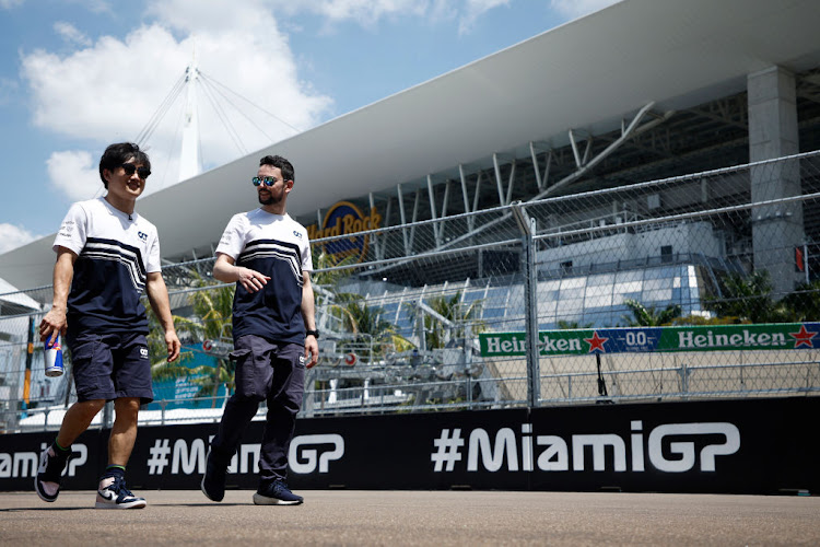 Yuki Tsunoda walks the track on Thursday during previews ahead of the F1 Grand Prix of Miami at the Miami International Autodrome.