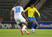 Sphelele Mkhulise of Mamelodi Sundowns is challenged by Siyabonga Nhlapo of Supersport United in the DStv Premiership match at Lucas Moripe Stadium in Pretoria on December 11 2021.