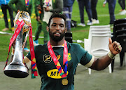 Springboks captain Siya Kolisi celebrates with the British & Irish Lions Trophy after the match.