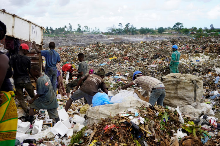 Minors offload garbage at Mwakirunge dumpsite.