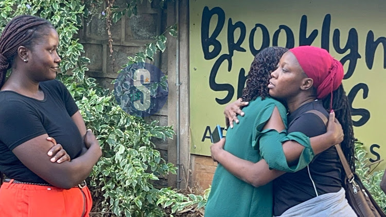 Nation Media Group's Roslyne Obala being comforted outside the late Veteran journalist Rita Tinina's apartment in Kileleshwa, Nairobi on March 17, 2024