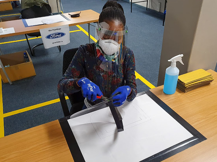 Protected from the virus, Ford employees are volunteering their services to help create 500,000 face masks.