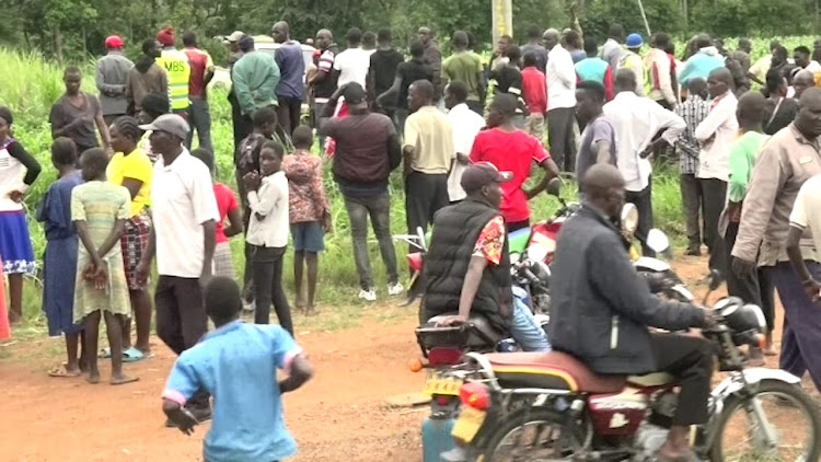 Residents at the scene of crime in Webuye on April 25, 2023.