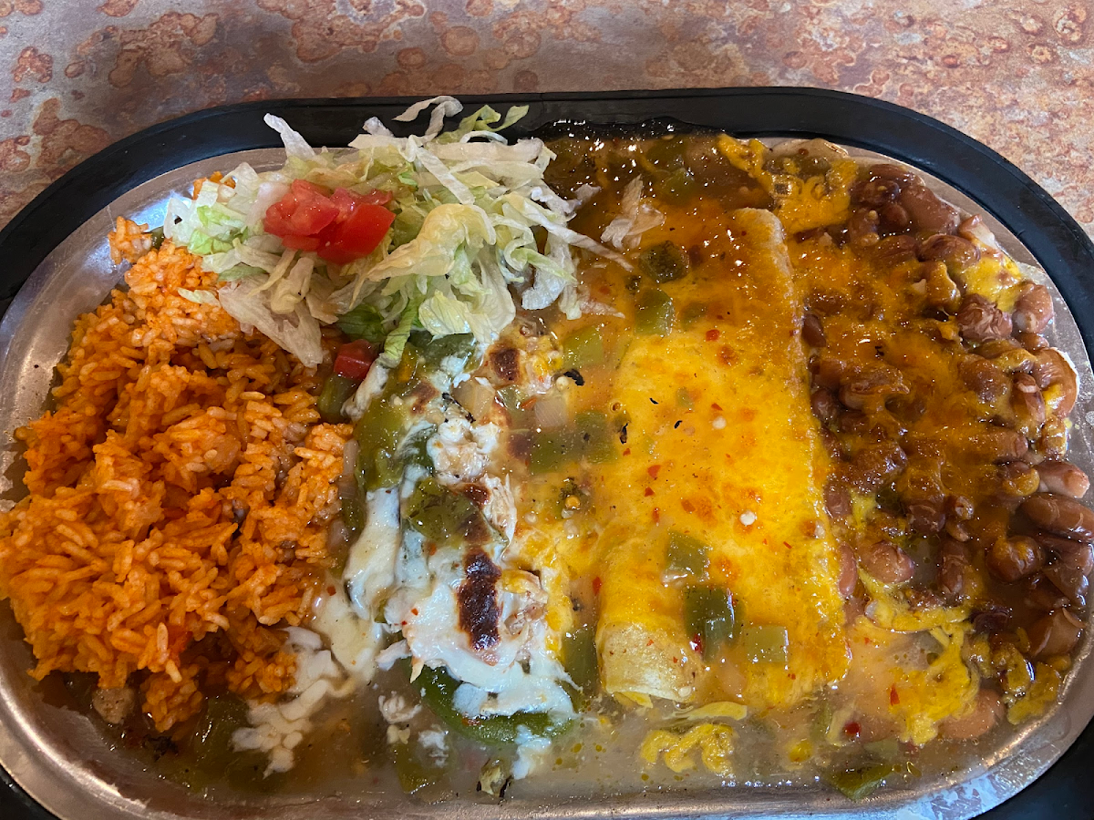 Naked chili Rellano with Turkey and Swiss cheese and a chicken enchilada with whole pinto beans and rice