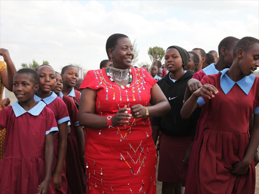 Kajiado Woman Rep Peris Tobiko dancing with school girls in Kajiado