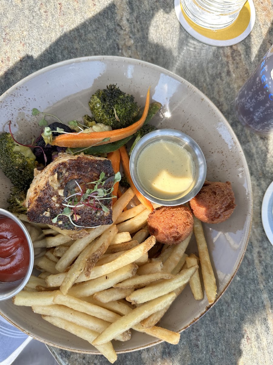 Amberjack buerre blanc sauce, french fries, hush puppies