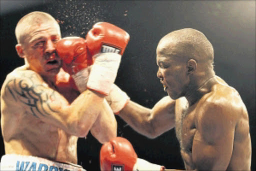 DAMAGE: Sipho Taliwe, right, throws a punch at Warren Joubert during their clash at Wembley Arena recently.Photo: Bafana Mahlangu