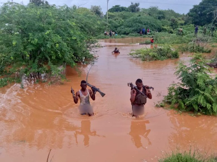 GSU Officers walk out of submerged camps in Tan Delta.